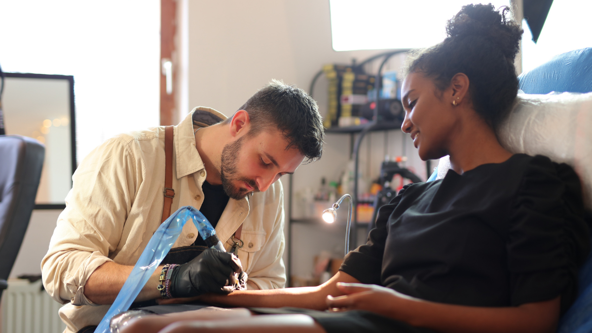 A client relaxed during a tattoo session 
