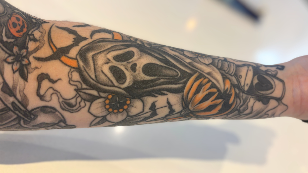  a healed black and grey tattoo with pops of colour 