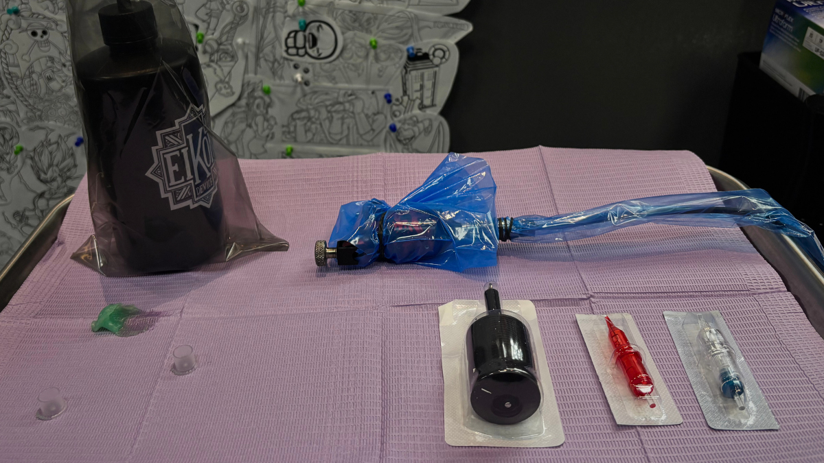 A tattoo artist's workstation set up with sealed single use equipment
